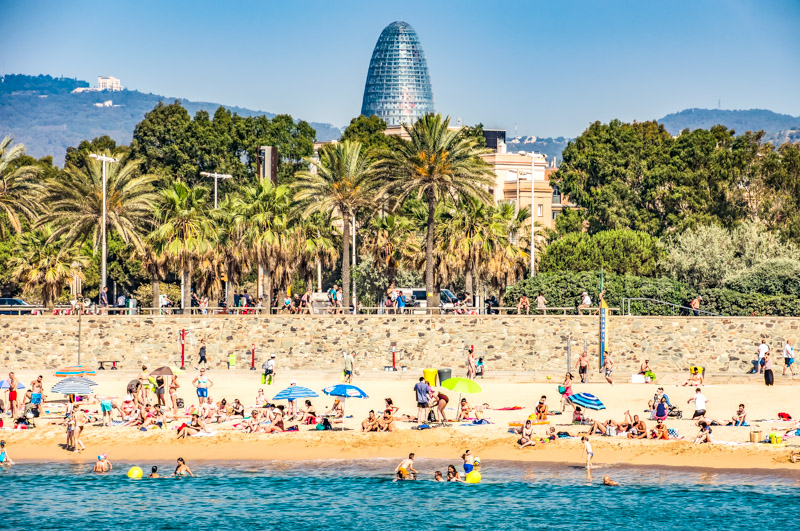 Barceloneta Beach from sea with crowds of people